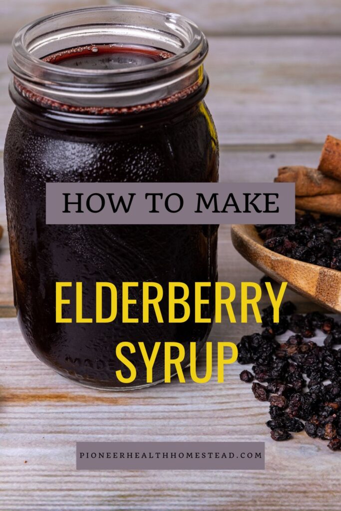 elderberry syrup in a mason jar with dried elderberries around