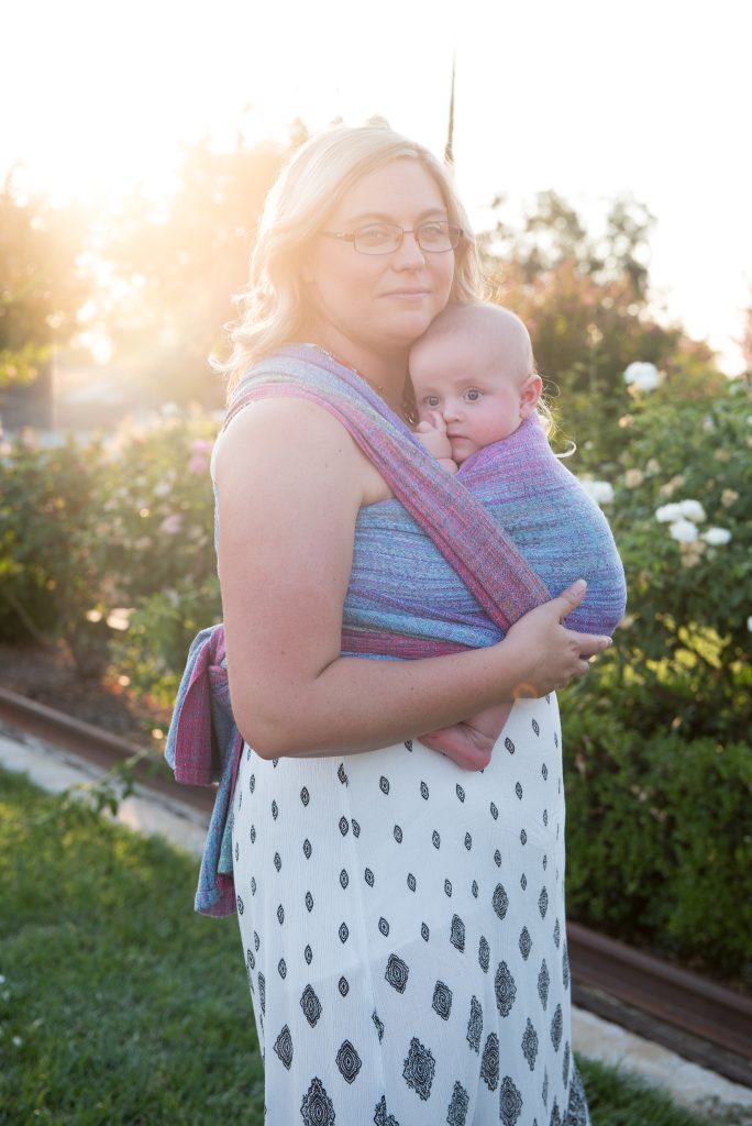 woman babywearing a baby in a handwoven wrap