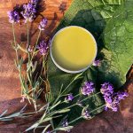 herbal salve with comfrey leaf and lavender flowers