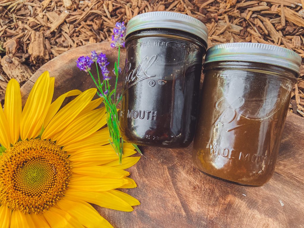 herbal syrups with sunflower and lavender flowers