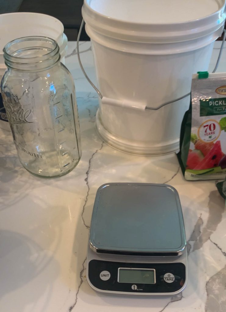 kitchen scale, gallon bucket, mason jar, pickling lime