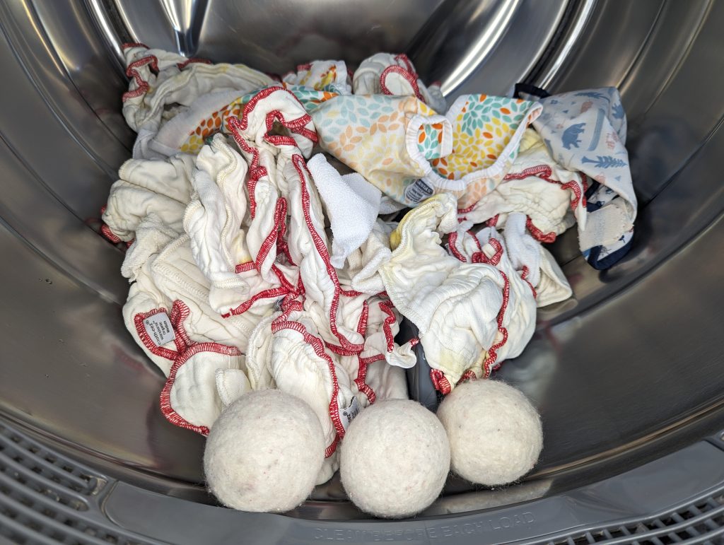 cloth diapers in dryer with wool dryer balls