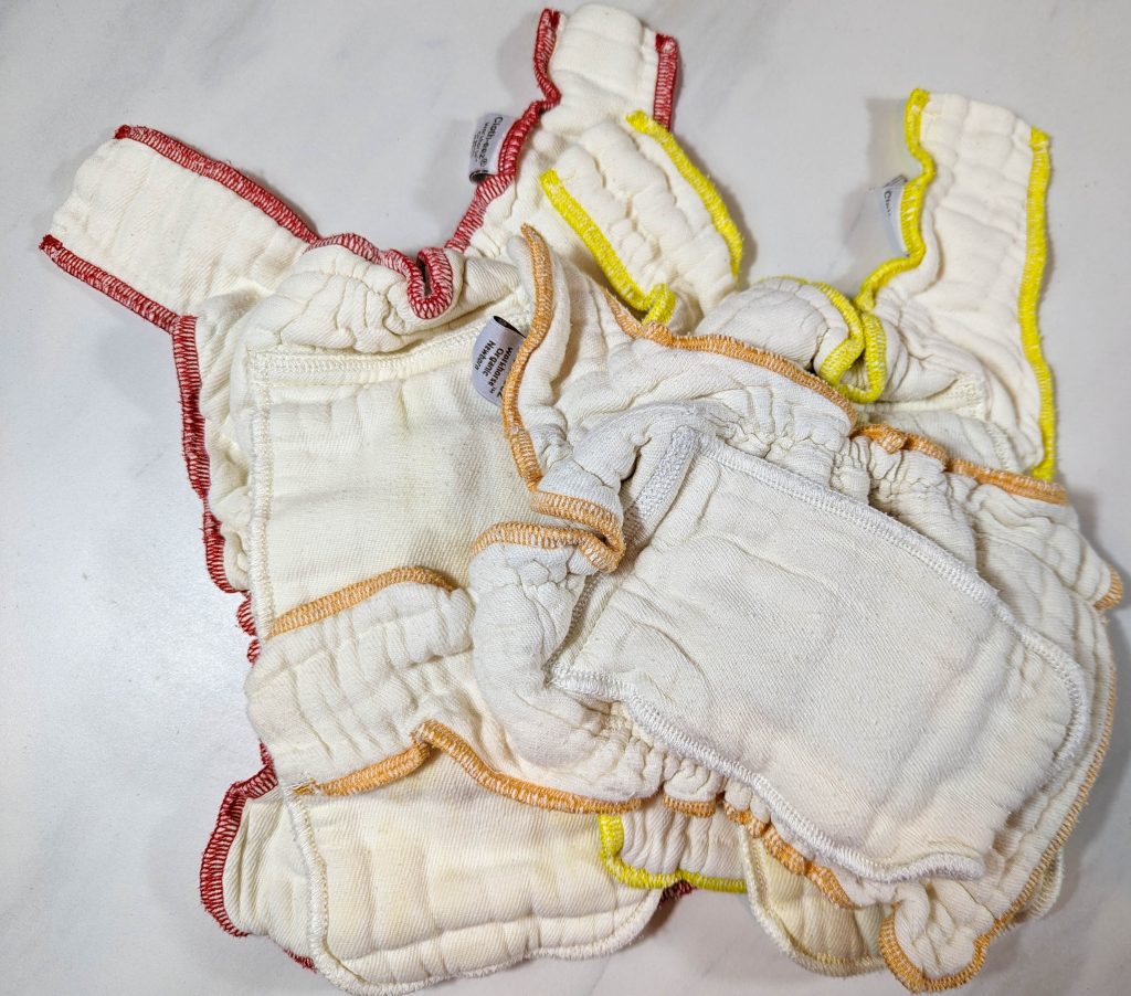 3 fitted cloth diapers in newborn small and medium sizes