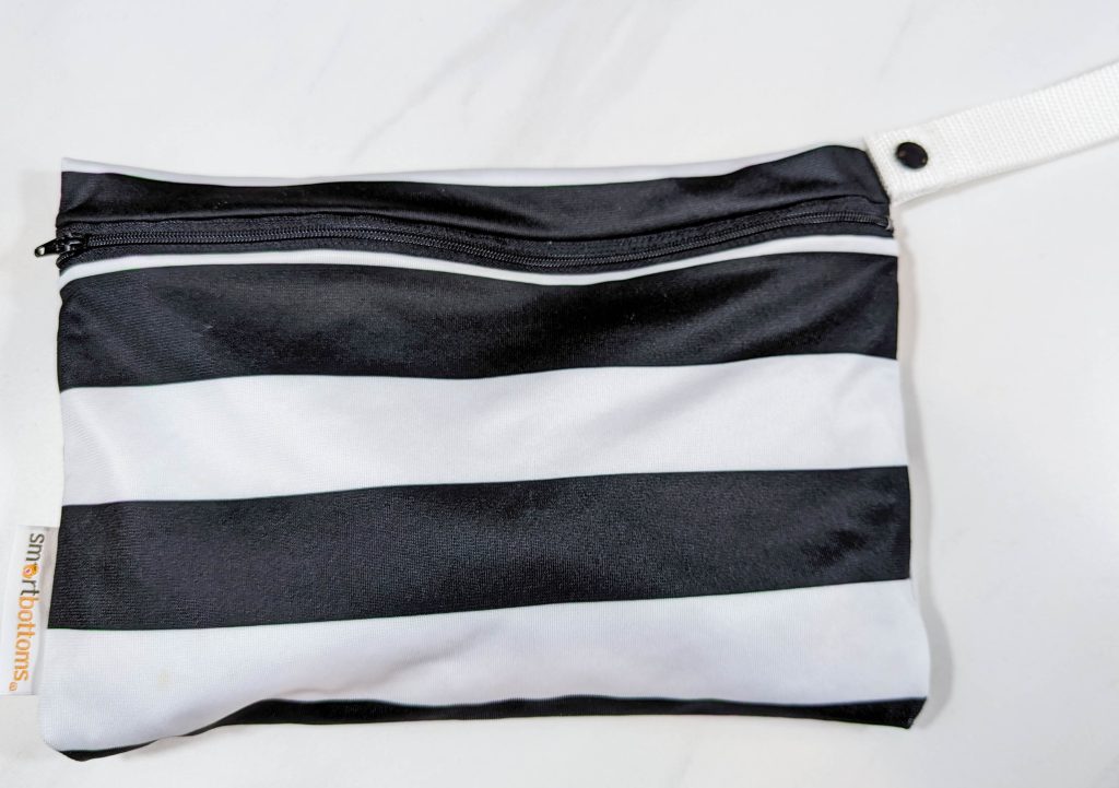 small wet bag in black and white stripes