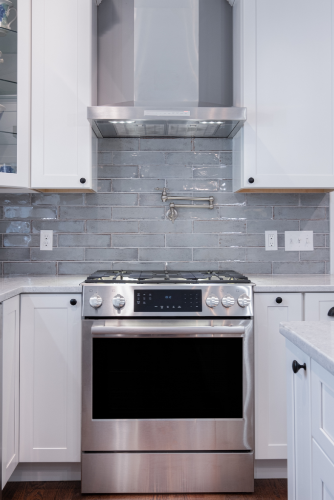 gas stove with stainless steel range hood white kitchen