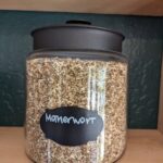 Motherwort dried herb in a glass jar on a wood shelf