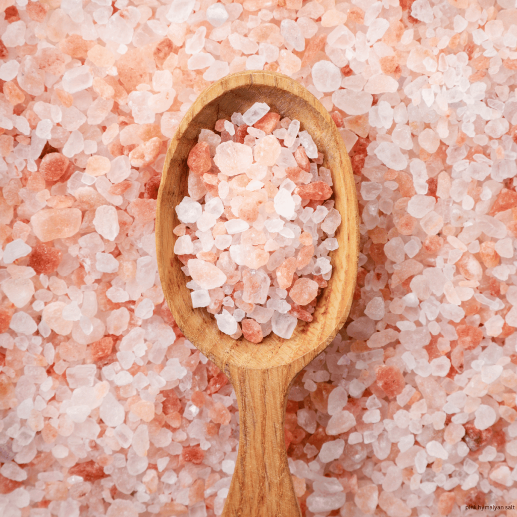 pink himalyan salt in wood spoon