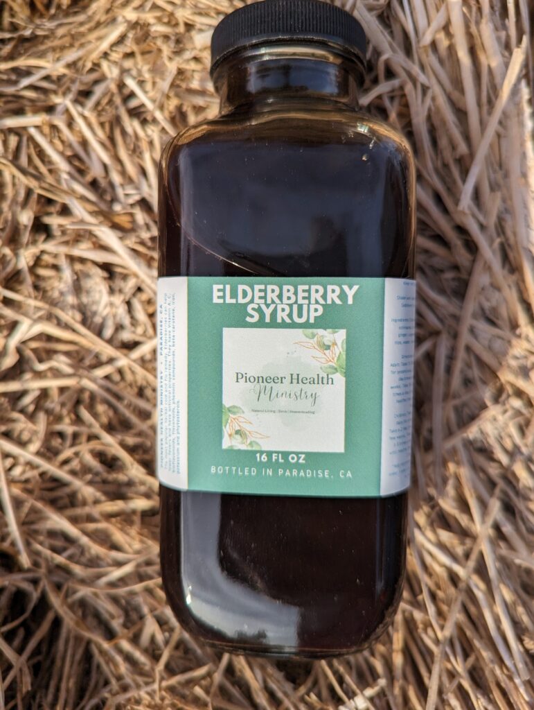 pioneer health ministry elderberry syrup on bed of hay