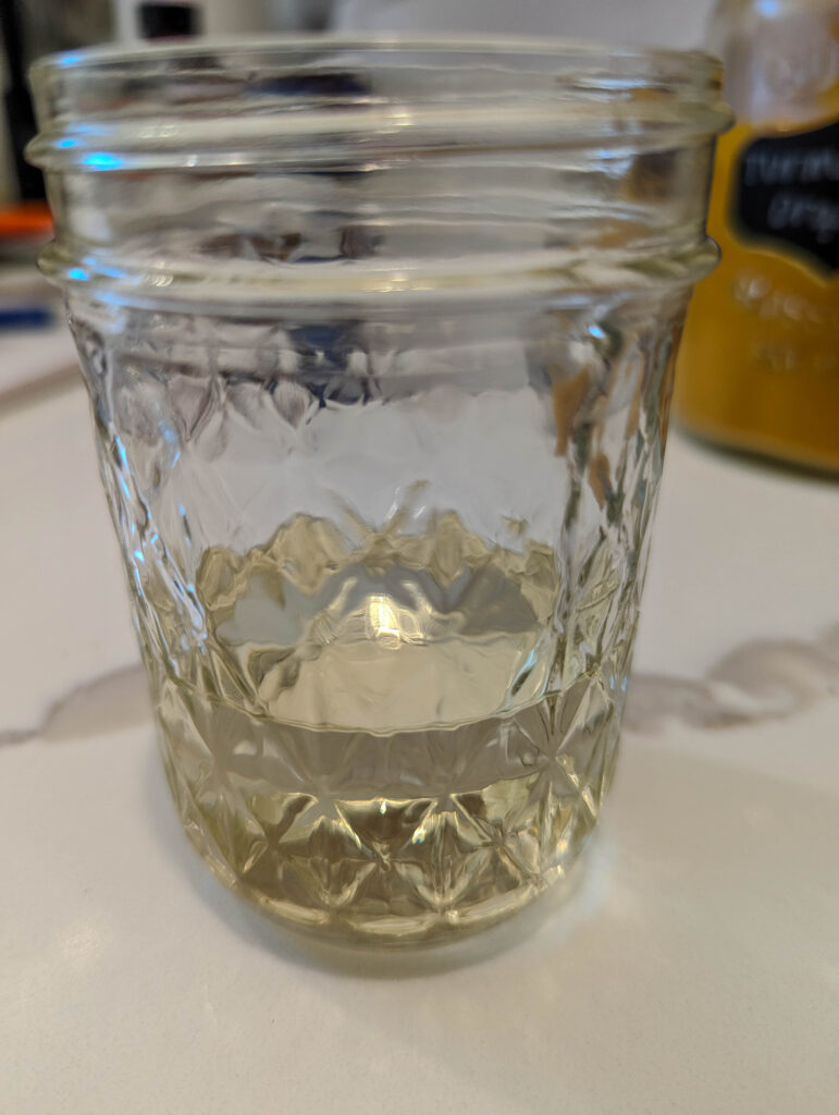 essential oils measured out in mason jar