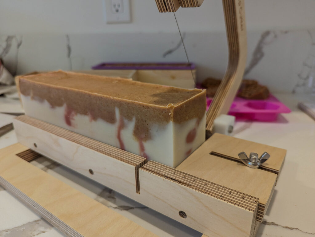 Cutting the herbal soap loaf to desired size