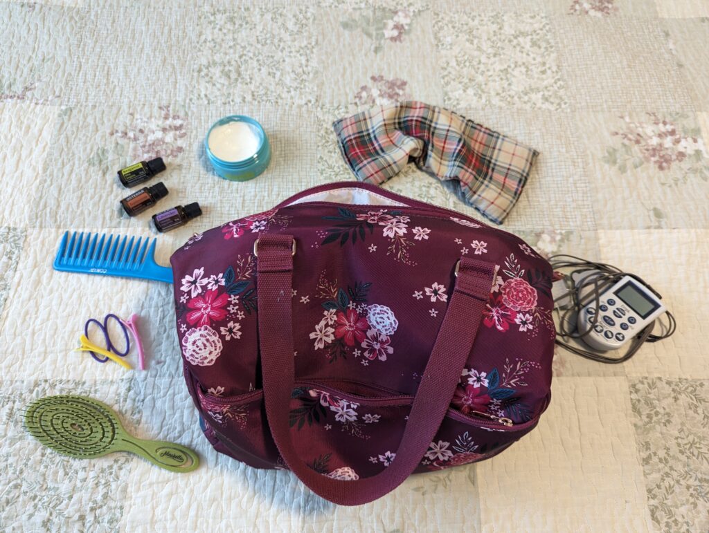 Doula bag with hair brush comb hair ties doterra essential oils heat pack tens unit