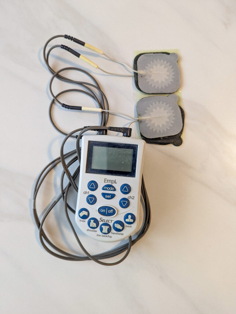 tens unit with wires and sticky pads