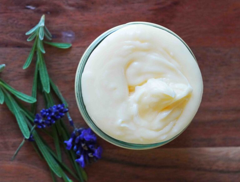 Magnesium lotion with Lavender flowers on wood cutting board