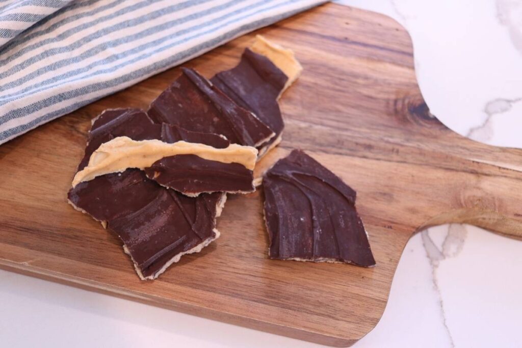 dark chocolate peanut butter yogurt bark on cutting board sideways