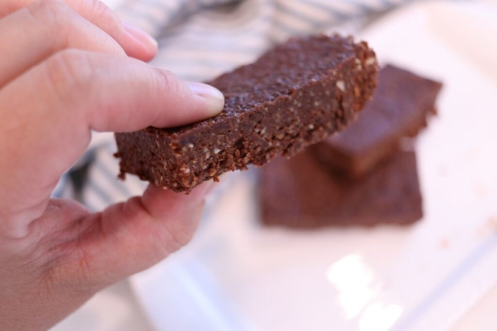 easy homemade chocolate larabars with hand holding