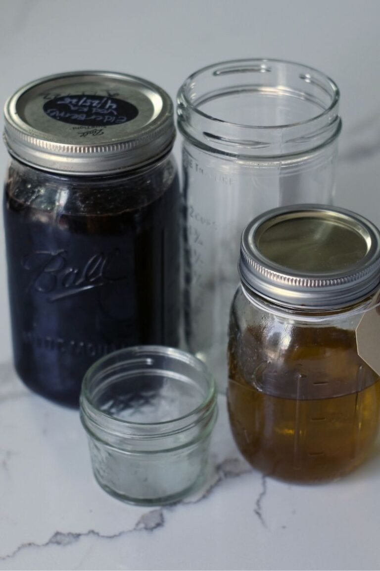 herbalist kitchen must haves checklist mason jars with tincture and herbal oil