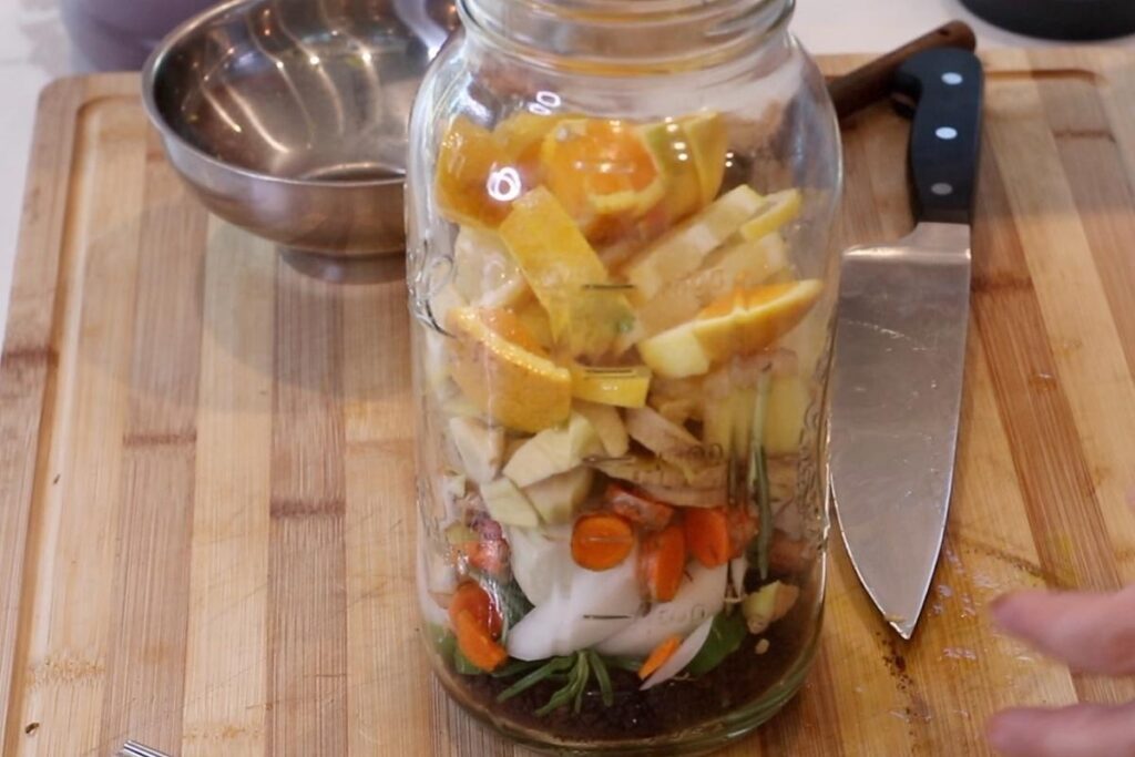 ingredients for elderberry fire cider in half gallon mason jar