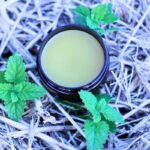 lemon balm salve on hay with plant large