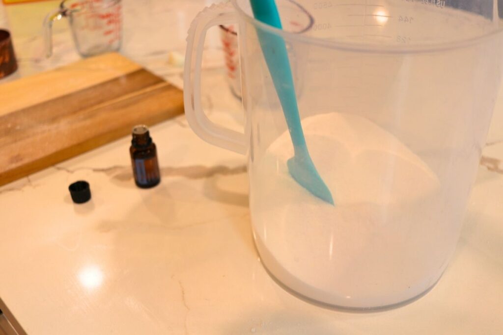 mixing all the powdered ingredients into a large container adding essential oils