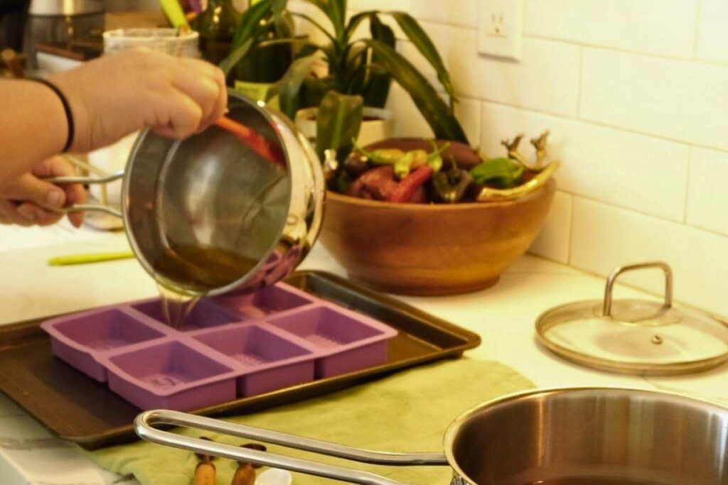 pouring out oils into mold